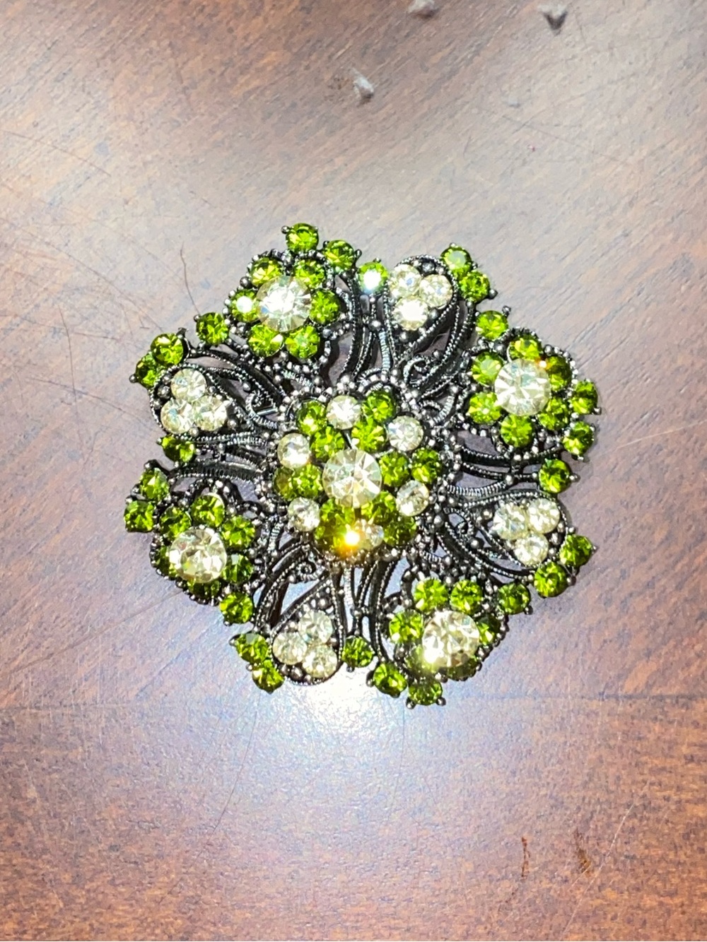 Vintage Silver Tone Peridot Green Rhinestone Filigree Wreath Brooch Pin